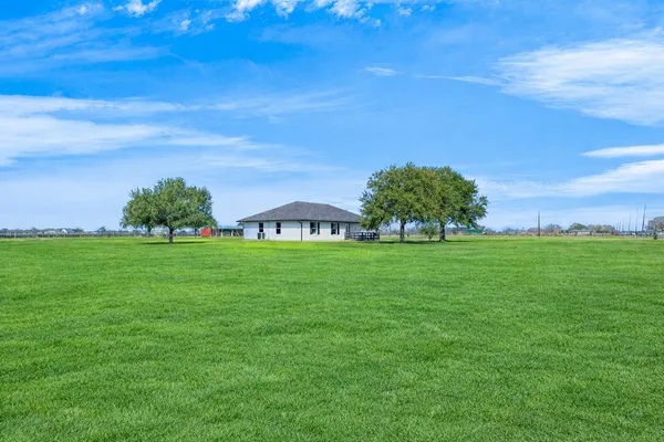 a view of a house with a big yard