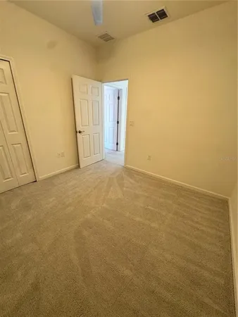 a spacious bathroom with a bathtub sink mirror and toilet