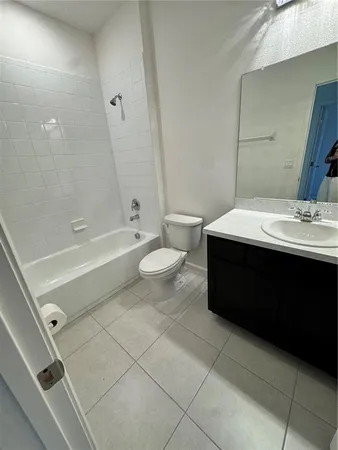 a large kitchen with kitchen island a large counter space a sink and appliances