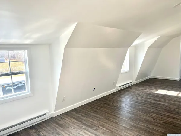 an entryway with wooden floor