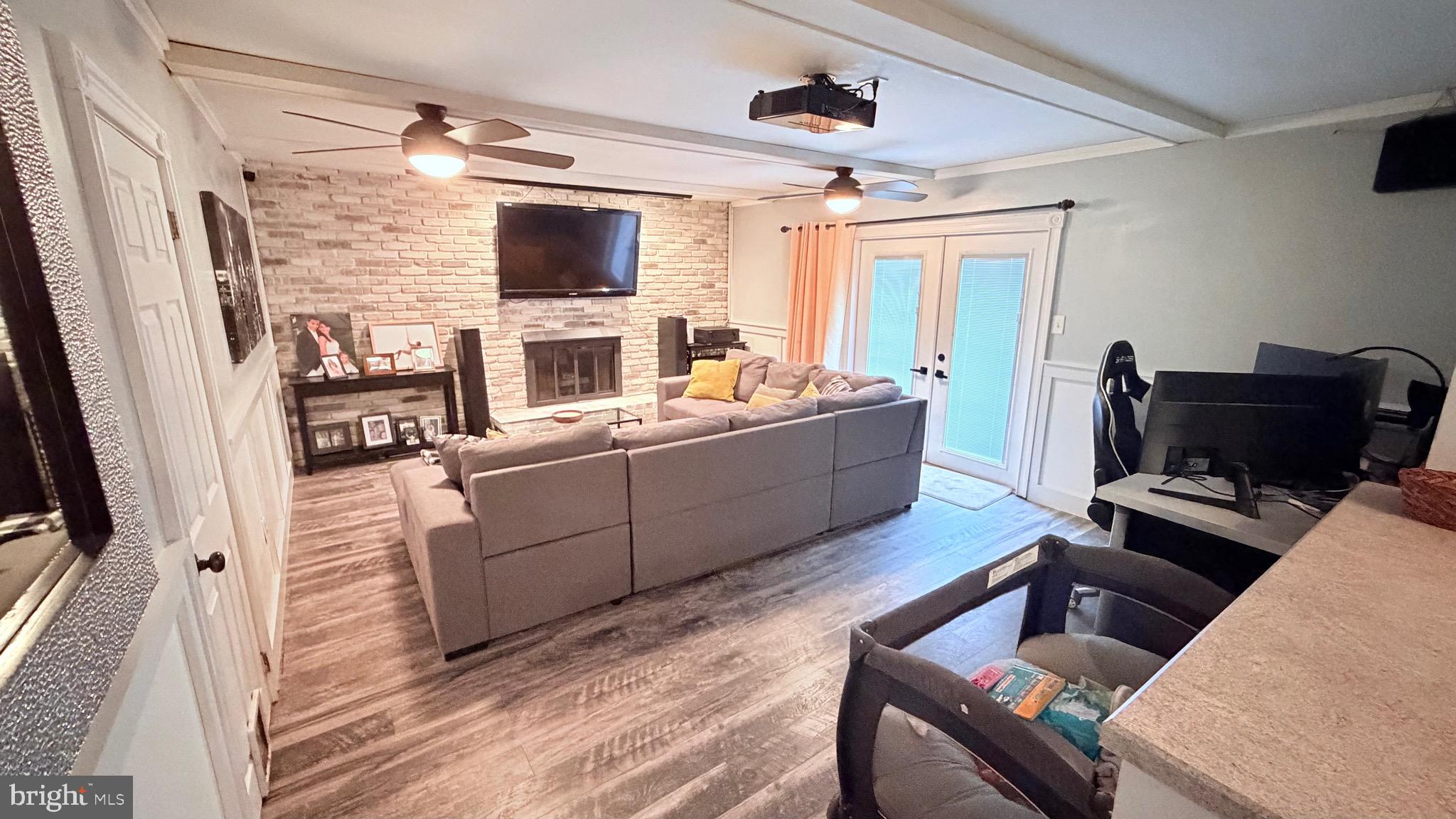 9 East Kennedy Drive Clementon, NJ 08021 - Photo 16 of 60 a living room with furniture and a flat screen tv