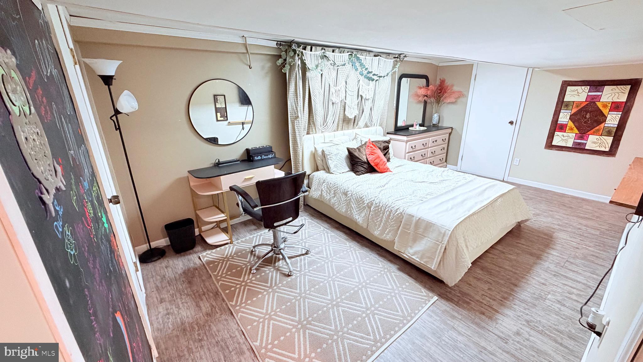 9 East Kennedy Drive Clementon, NJ 08021 - Photo 23 of 60 a bedroom with a bed a mirror and a large window