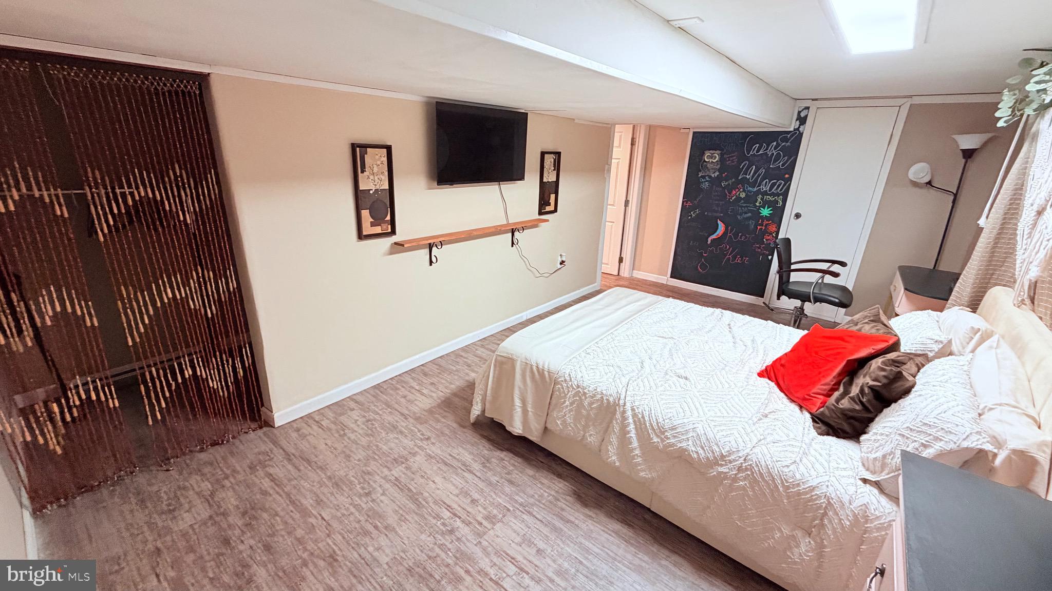 9 East Kennedy Drive Clementon, NJ 08021 - Photo 26 of 60 a bedroom with a bed and a flat tv screen on dresser