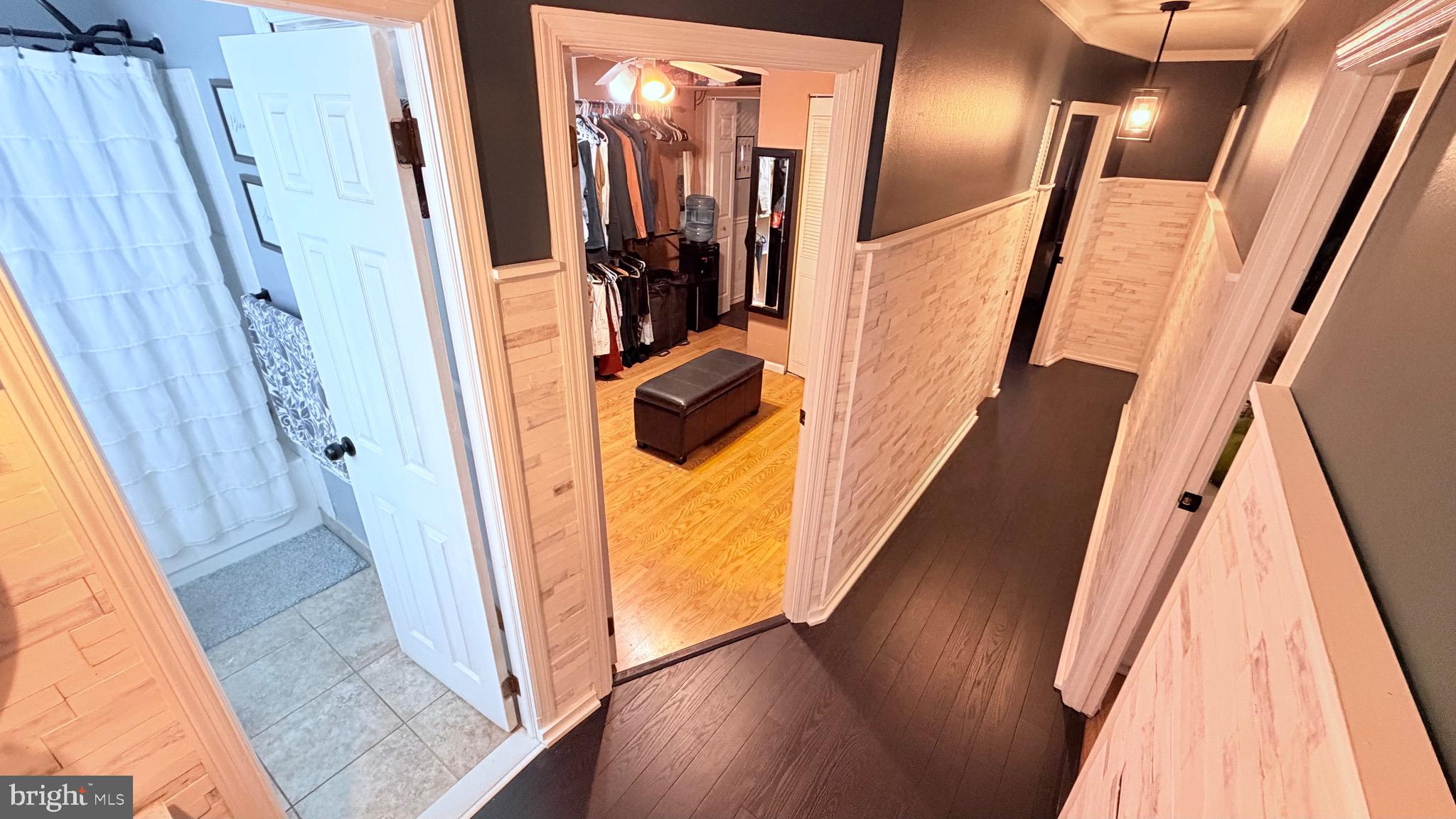 9 East Kennedy Drive Clementon, NJ 08021 - Photo 27 of 60 a view of a hallway with wooden floor and stairs