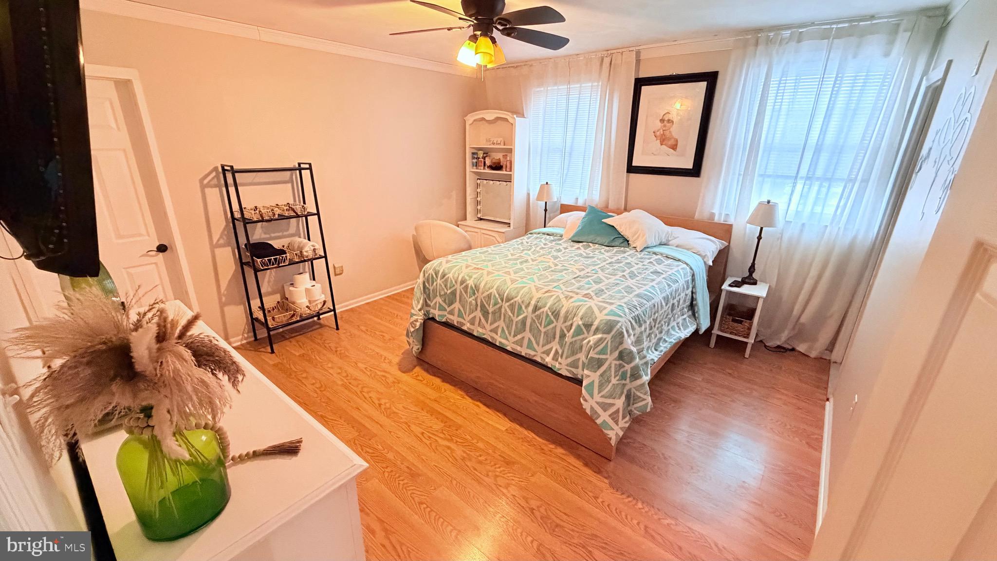 9 East Kennedy Drive Clementon, NJ 08021 - Photo 29 of 60 a bedroom with a bed and a flat tv screen on dresser