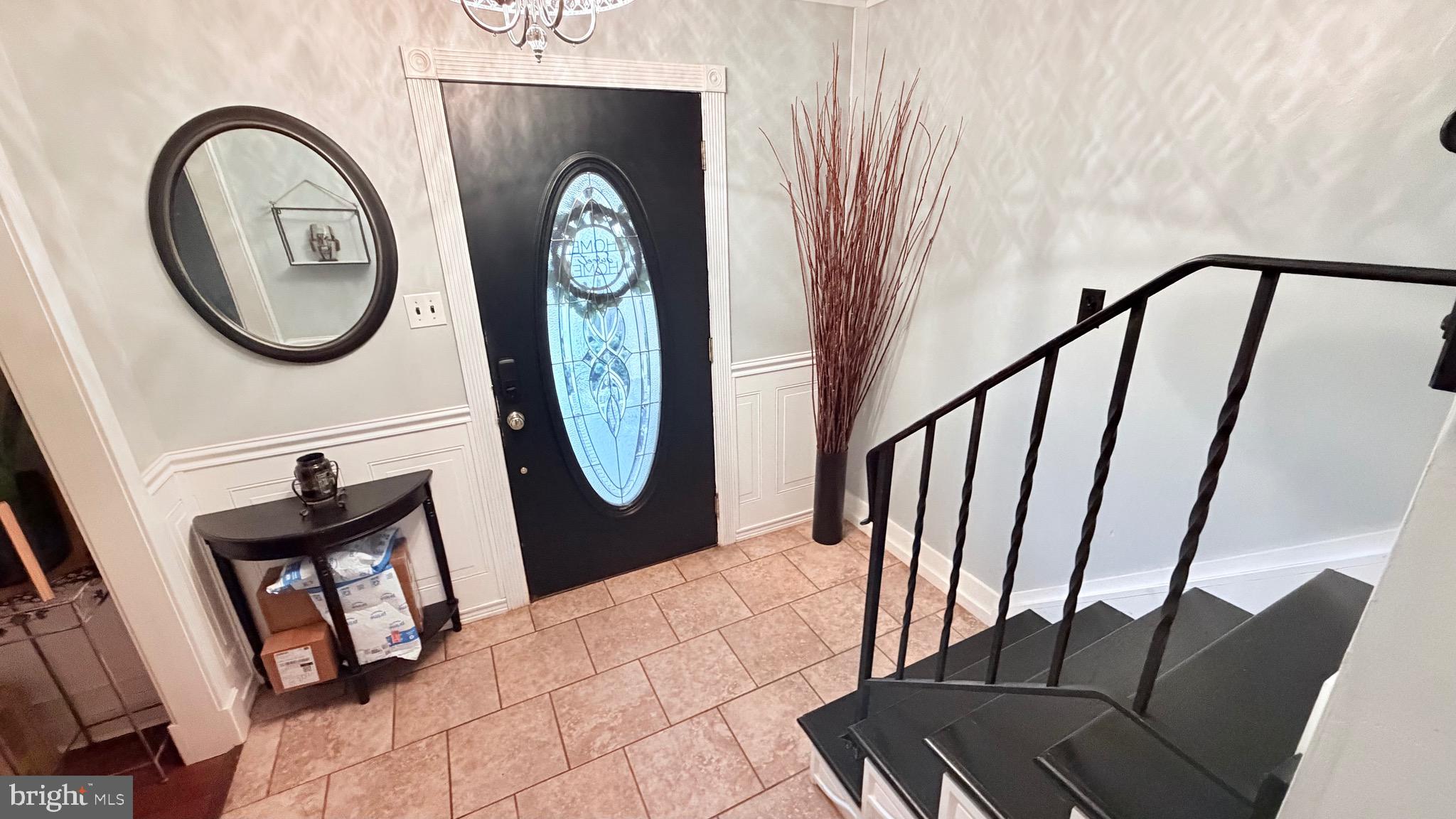 9 East Kennedy Drive Clementon, NJ 08021 - Photo 6 of 60 a view of a hallway with entryway wooden floor and a rug