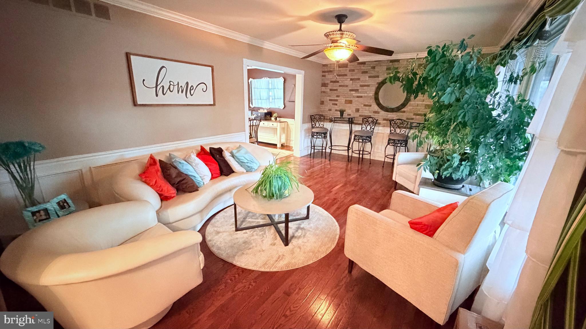 9 East Kennedy Drive Clementon, NJ 08021 - Photo 8 of 60 a living room with patio furniture and a large window
