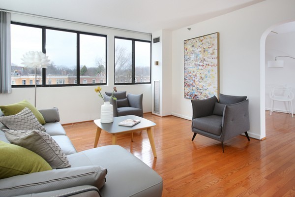 1731 Beacon Street, Unit 512 Brookline, MA 02445 - Photo 1 of 5 a living room with furniture and a large window