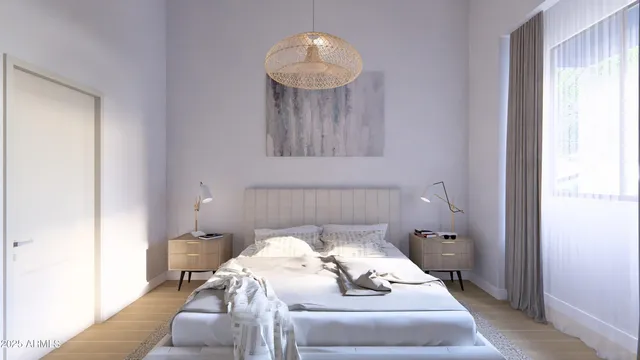 a bedroom with a bed and a mirror