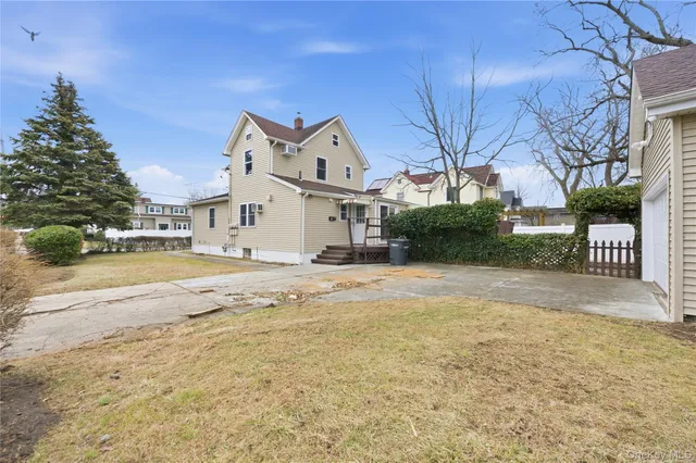 a view of a house with a snow in the yard