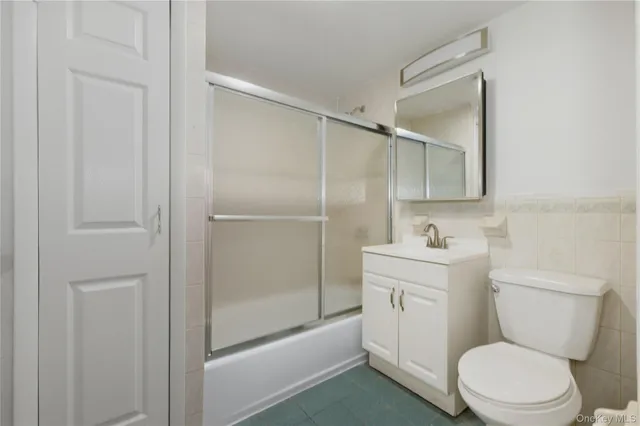a bathroom with a toilet a sink and shower