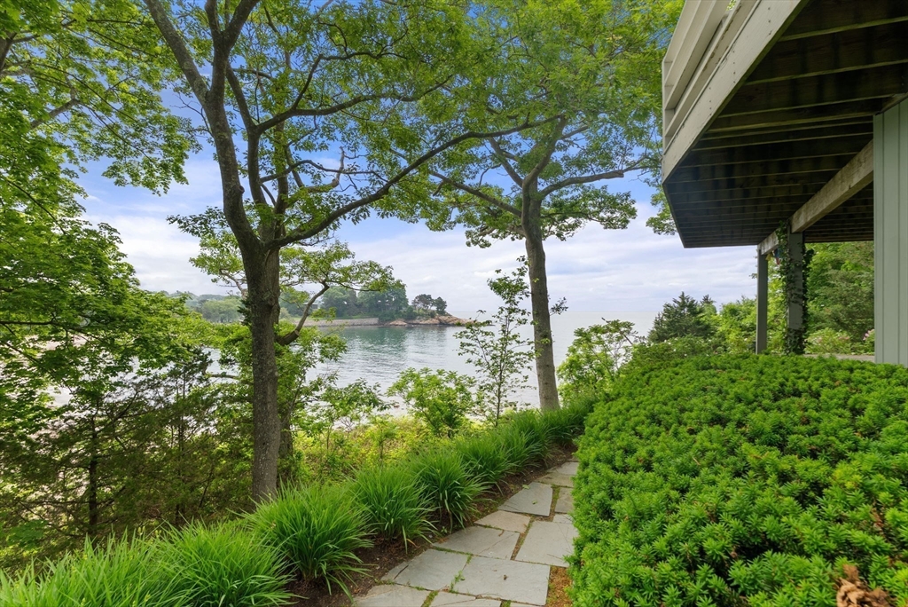 23 Ocean Street Manchester, MA 01944 - Photo 6 of 36 a view of a garden