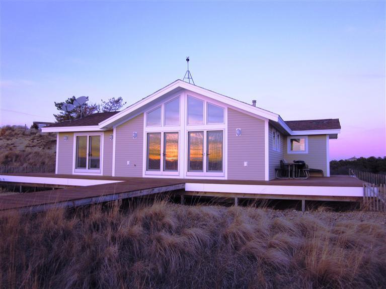 80 2nd Avenue Wellfleet, MA 02642 - Photo 30 of 35 a front view of a house with a yard