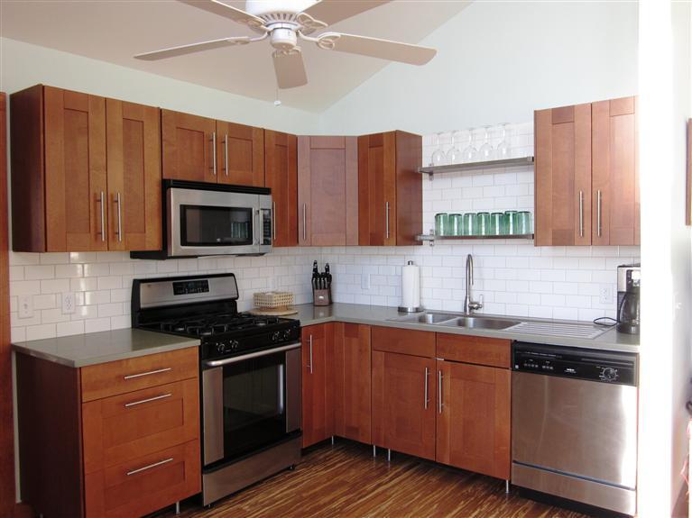80 2nd Avenue Wellfleet, MA 02642 - Photo 9 of 35 a kitchen with sink a microwave and cabinets
