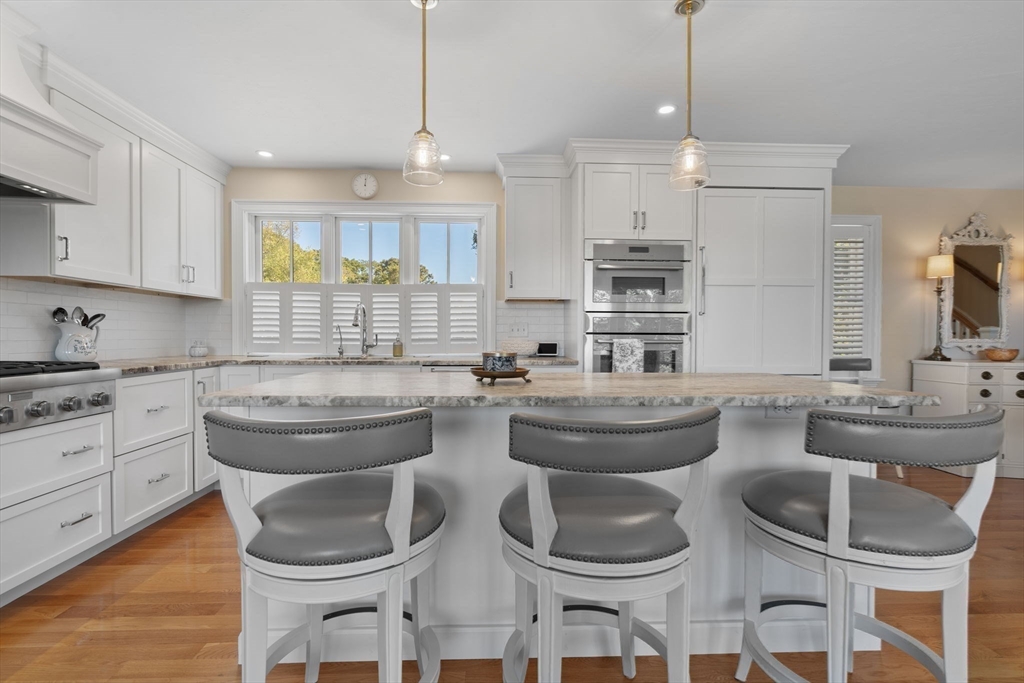 191 Stoney Point Road Barnstable, MA 02675 - Photo 12 of 36 a kitchen with a table and chairs