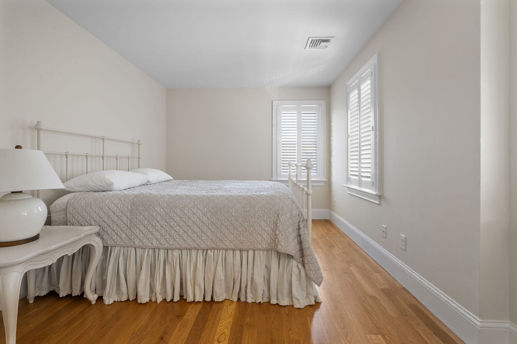 191 Stoney Point Road Barnstable, MA 02675 - Photo 25 of 36 a bedroom with a bed and a window