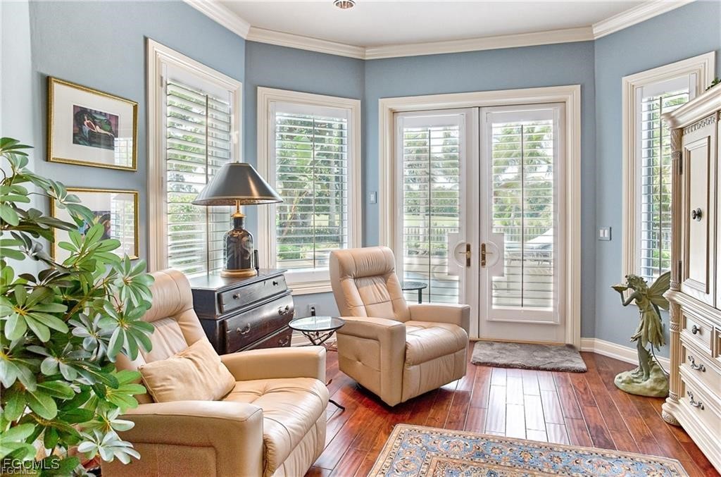 2729 Wulfert Road Sanibel, FL 33957 - Photo 15 of 31 a living room with furniture and a large window
