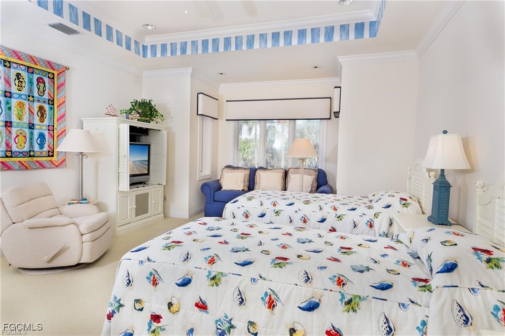 2729 Wulfert Road Sanibel, FL 33957 - Photo 19 of 31 a bedroom with a bed and a couch