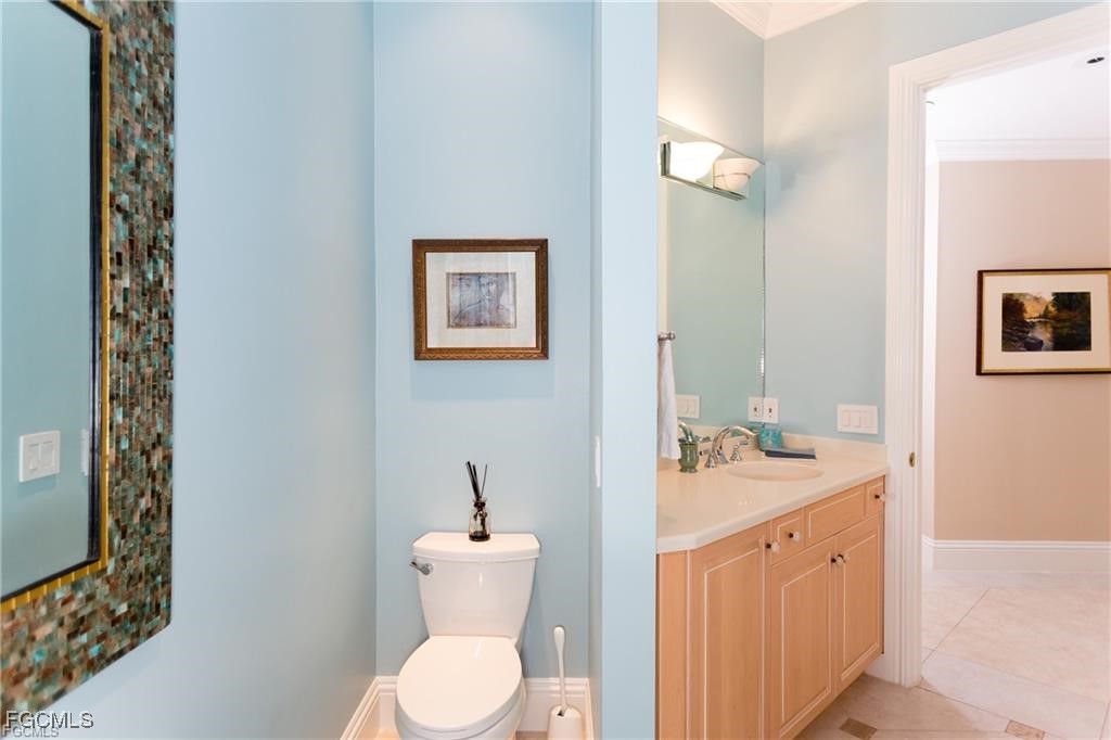 2729 Wulfert Road Sanibel, FL 33957 - Photo 24 of 31 a spacious bathroom with a toilet sink and mirror