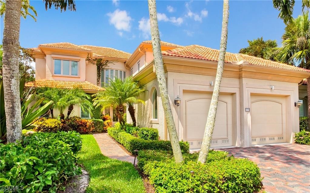 2729 Wulfert Road Sanibel, FL 33957 - Photo 3 of 31 front view of a house with a garden