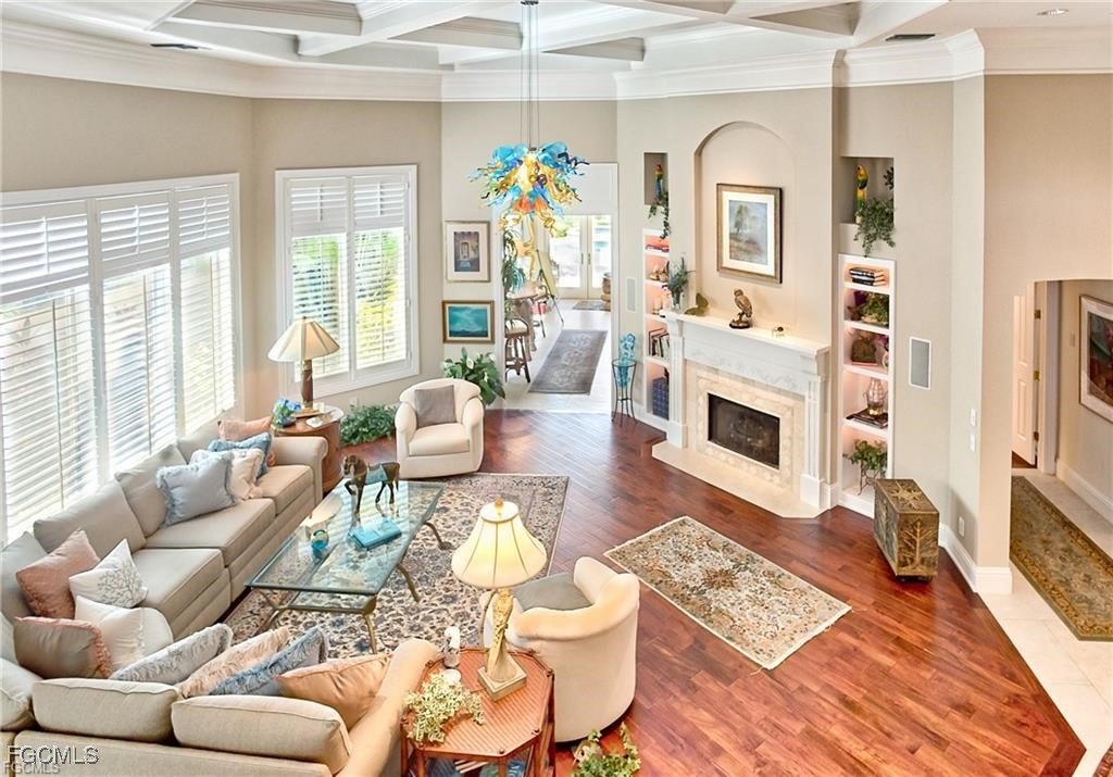 2729 Wulfert Road Sanibel, FL 33957 - Photo 5 of 31 a living room with furniture fireplace and a flat screen tv