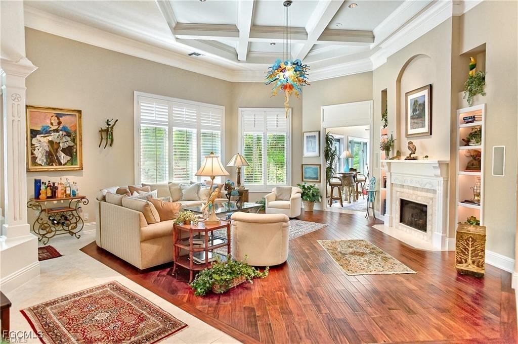 2729 Wulfert Road Sanibel, FL 33957 - Photo 6 of 31 a living room with fireplace furniture and a large window