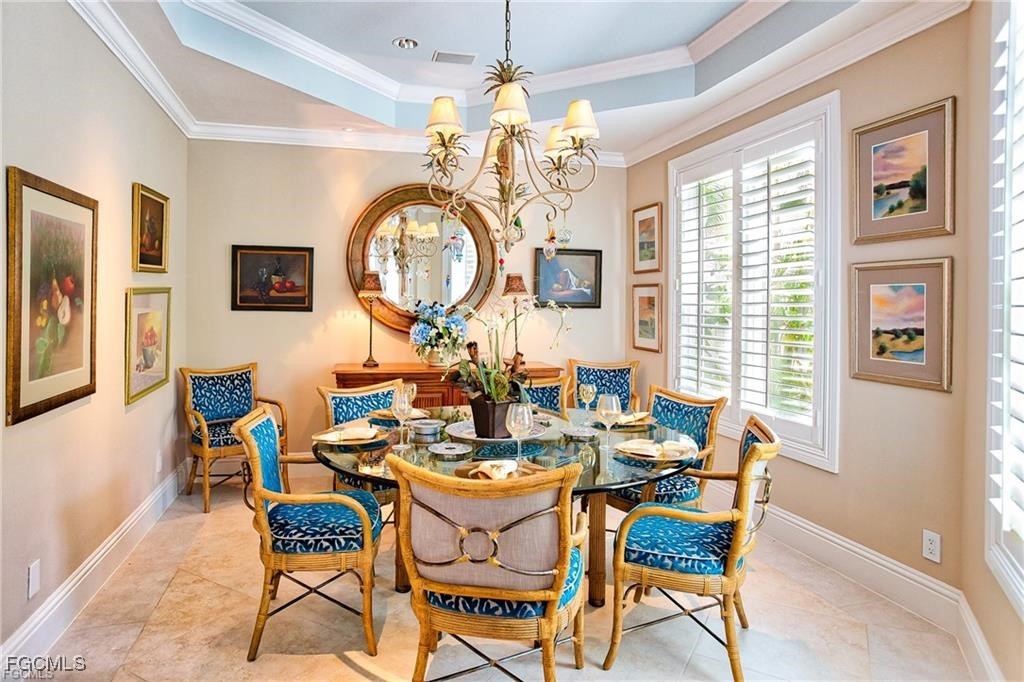 2729 Wulfert Road Sanibel, FL 33957 - Photo 9 of 31 a view of a dining room with furniture and a large window