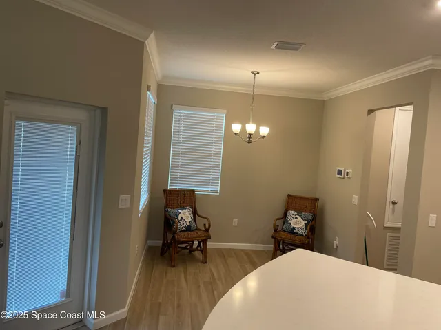 a view of a bathroom with sink and mirror
