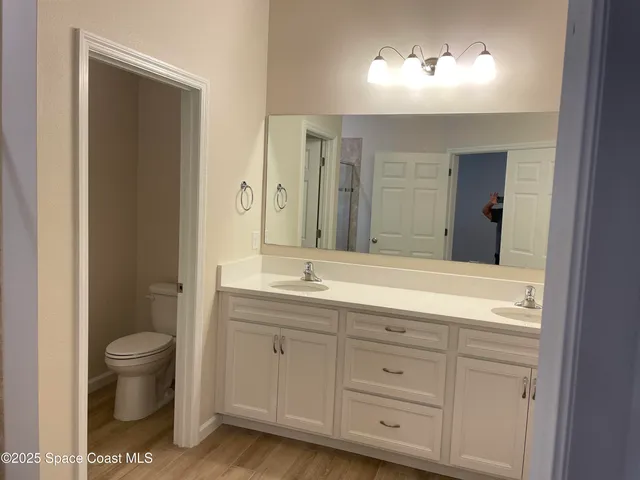 an empty room with a ceiling fan and window