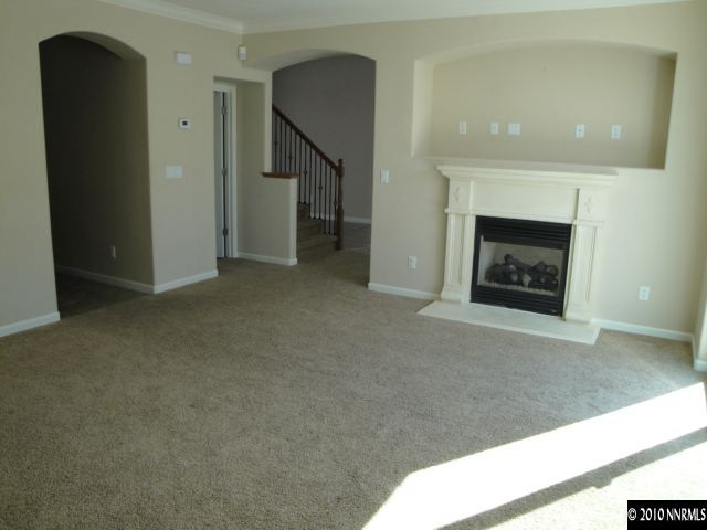 11335 Torino Way Reno, NV 89521 - Photo 3 of 9 a living room with a fireplace