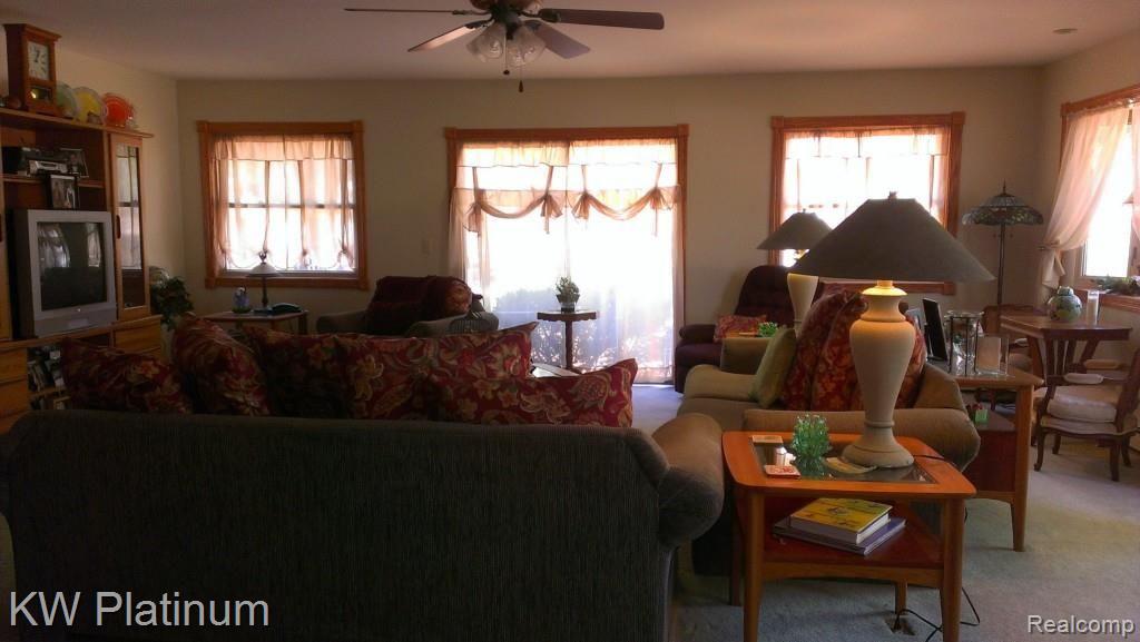 7230 Harrington Road Lexington, MI 48450 - Photo 23 of 46 living room full sun from west.jpg