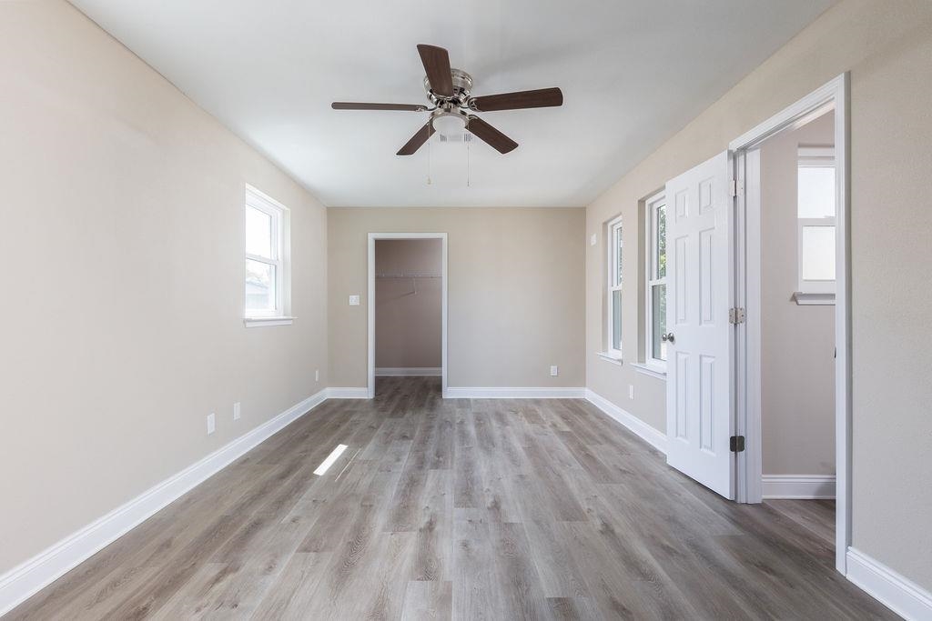3941 Baybrook Drive Pace, FL 32571 - Photo 13 of 28 wooden floor in an empty room with a window