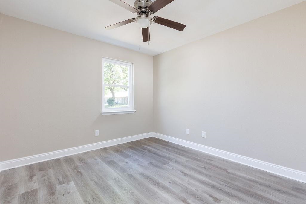 3941 Baybrook Drive Pace, FL 32571 - Photo 16 of 28 wooden floor in an empty room with a window