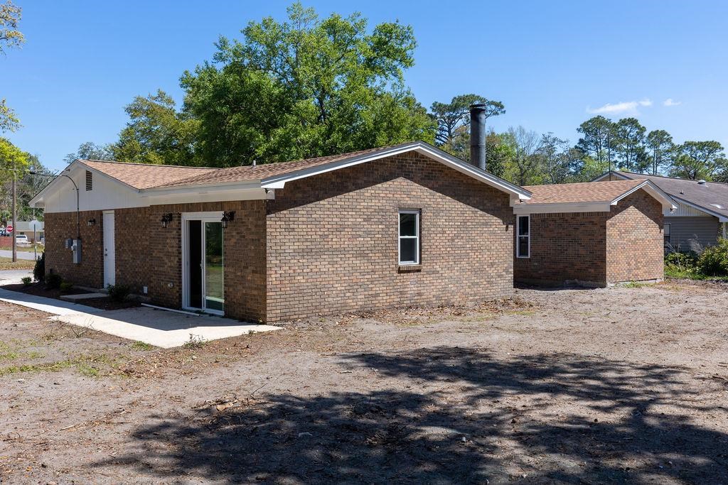 3941 Baybrook Drive Pace, FL 32571 - Photo 21 of 28 a front view of a house with a yard
