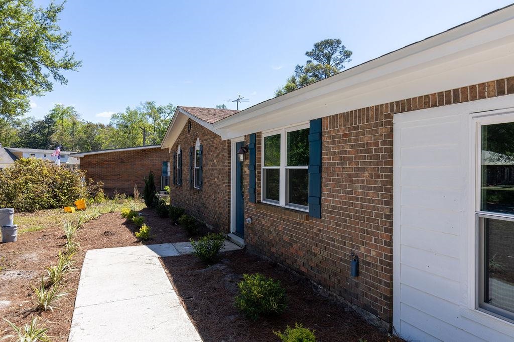 3941 Baybrook Drive Pace, FL 32571 - Photo 3 of 28 a backyard of a house with yard and outdoor seating