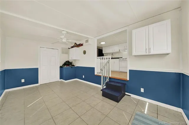 a bedroom with a bed and a night stand