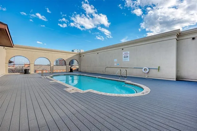 a view of a swimming pool from a balcony