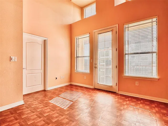 a view of an empty room with a window