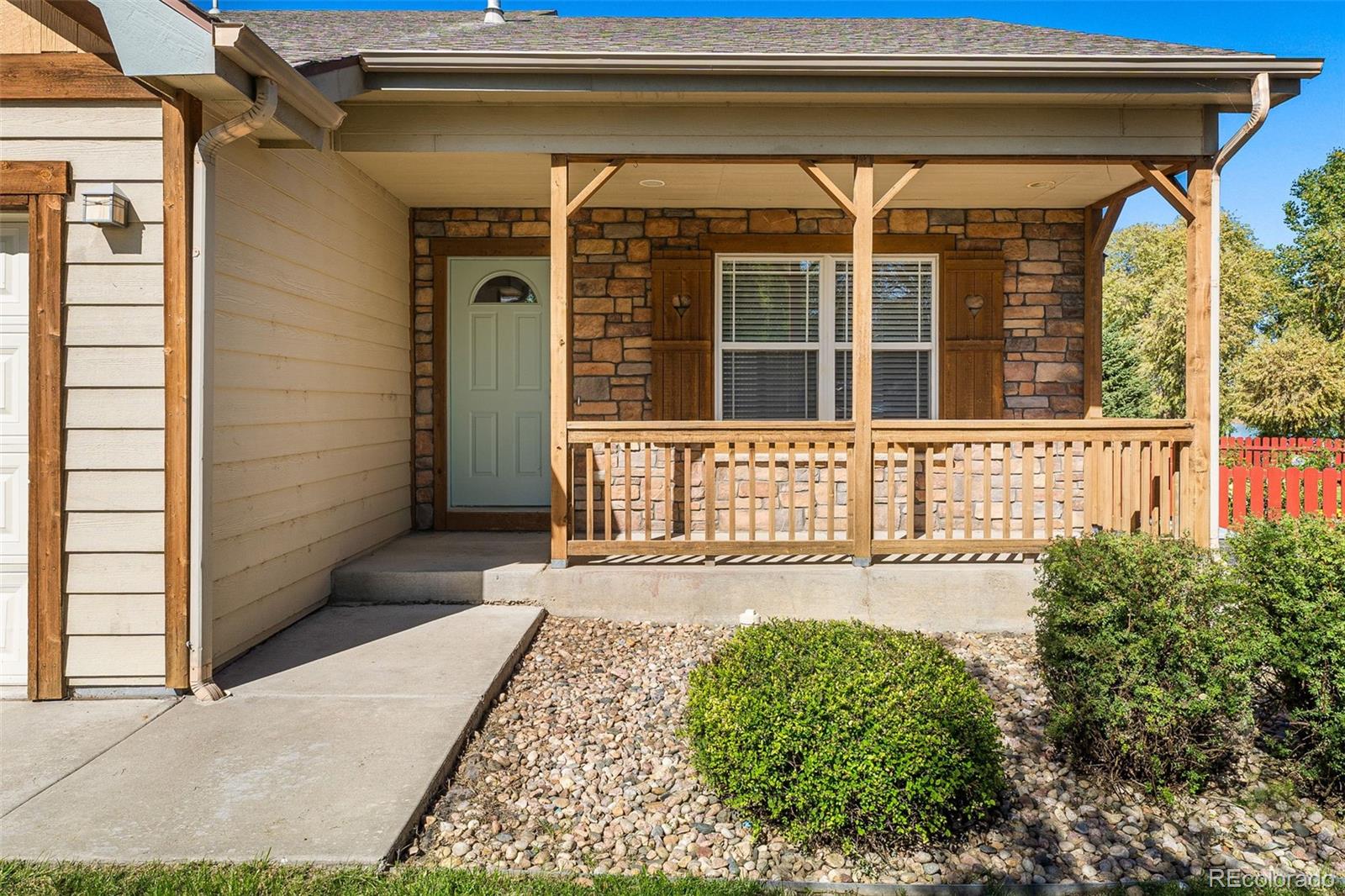 400 Sorrel Drive Windsor, CO 80550 - Photo 2 of 37 a front view of a house with a yard and outdoor space
