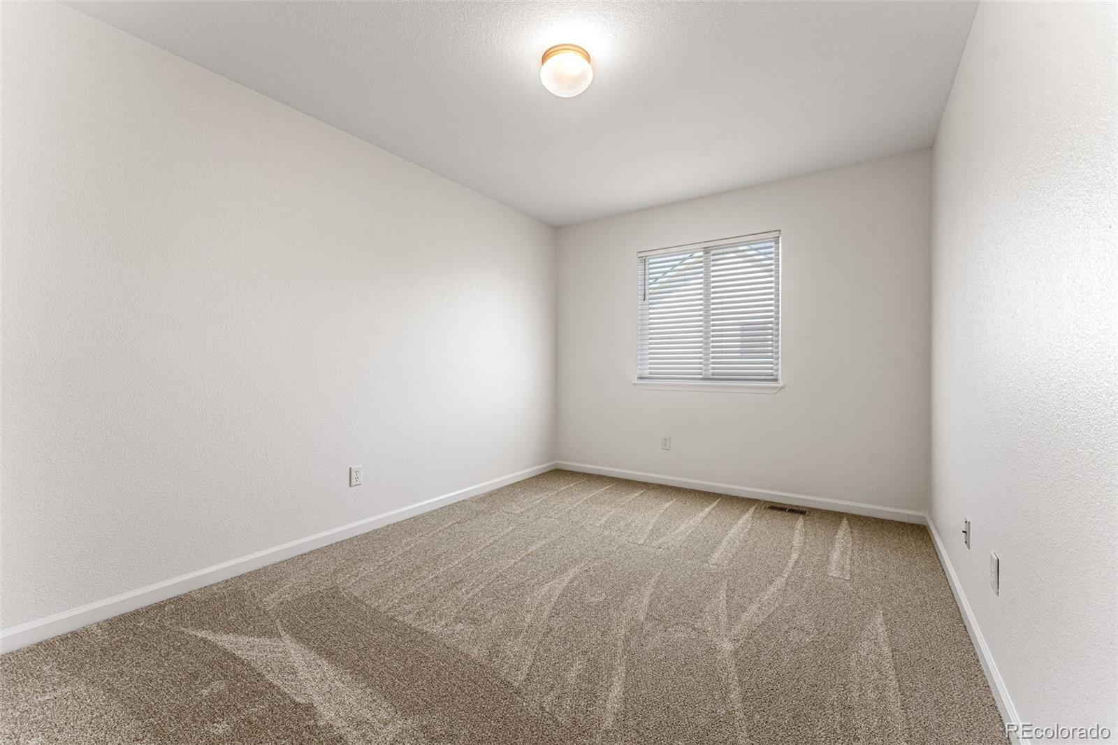 400 Sorrel Drive Windsor, CO 80550 - Photo 22 of 37 an empty room with a window