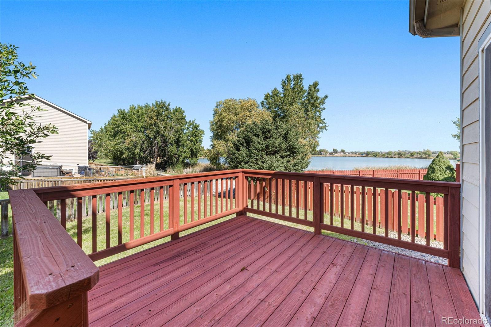 400 Sorrel Drive Windsor, CO 80550 - Photo 25 of 37 a balcony with wooden floor and fence