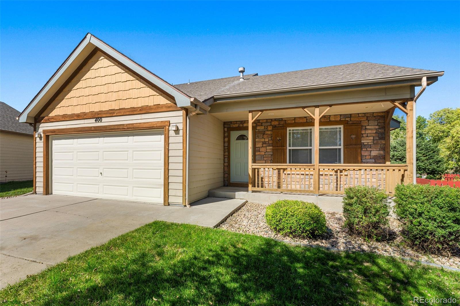 400 Sorrel Drive Windsor, CO 80550 - Photo 36 of 37 front view of a house with a yard