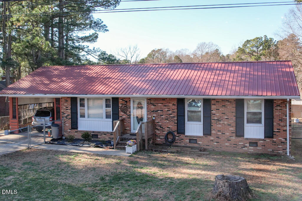 1727 Pinecrest Road Henderson, NC 27536 - Photo 13 of 14 a couple of table and chairs in front of house
