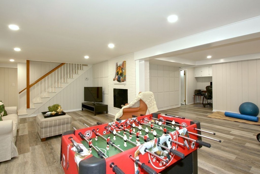 25 3 Ponds Road Wayland, MA 01778 - Photo 23 of 29 a living room with furniture and a flat screen tv