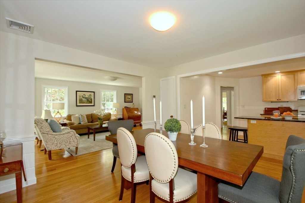 25 3 Ponds Road Wayland, MA 01778 - Photo 5 of 29 a living room with furniture kitchen view and a wooden floor