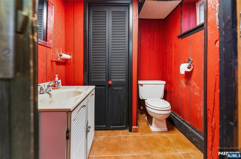 722 Oak Street Ridgefield, NJ 07657 - Photo 14 of 17 a bathroom with a sink toilet and shower