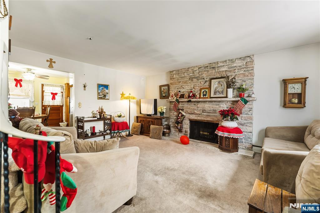 722 Oak Street Ridgefield, NJ 07657 - Photo 3 of 17 a living room with furniture and a fireplace