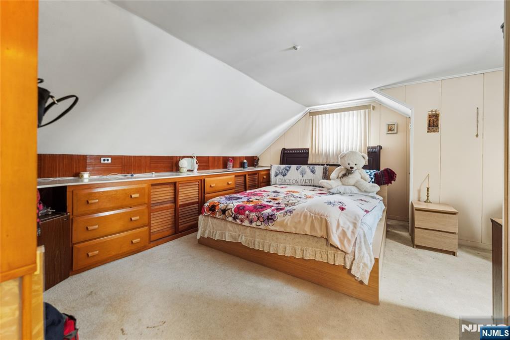 722 Oak Street Ridgefield, NJ 07657 - Photo 8 of 17 a bed room with a bed and a window