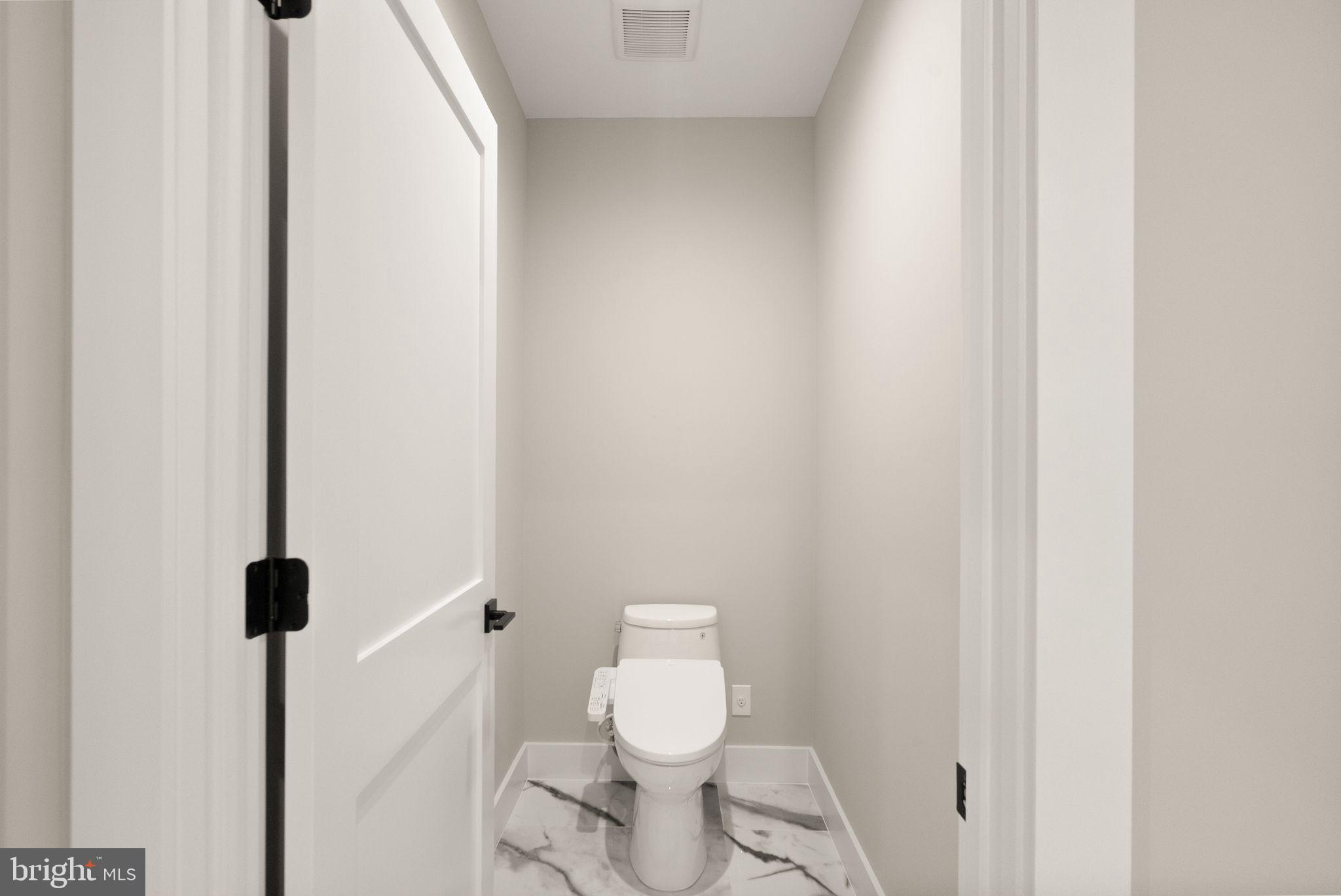 6329 Halsey Road McLean, VA 22101 - Photo 52 of 94 Sleek and modern powder room design.