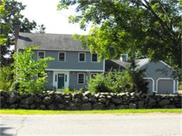 378 Burroughs Road Boxborough, MA 01719 - Photo 2 of 15 a front view of a house with a garden